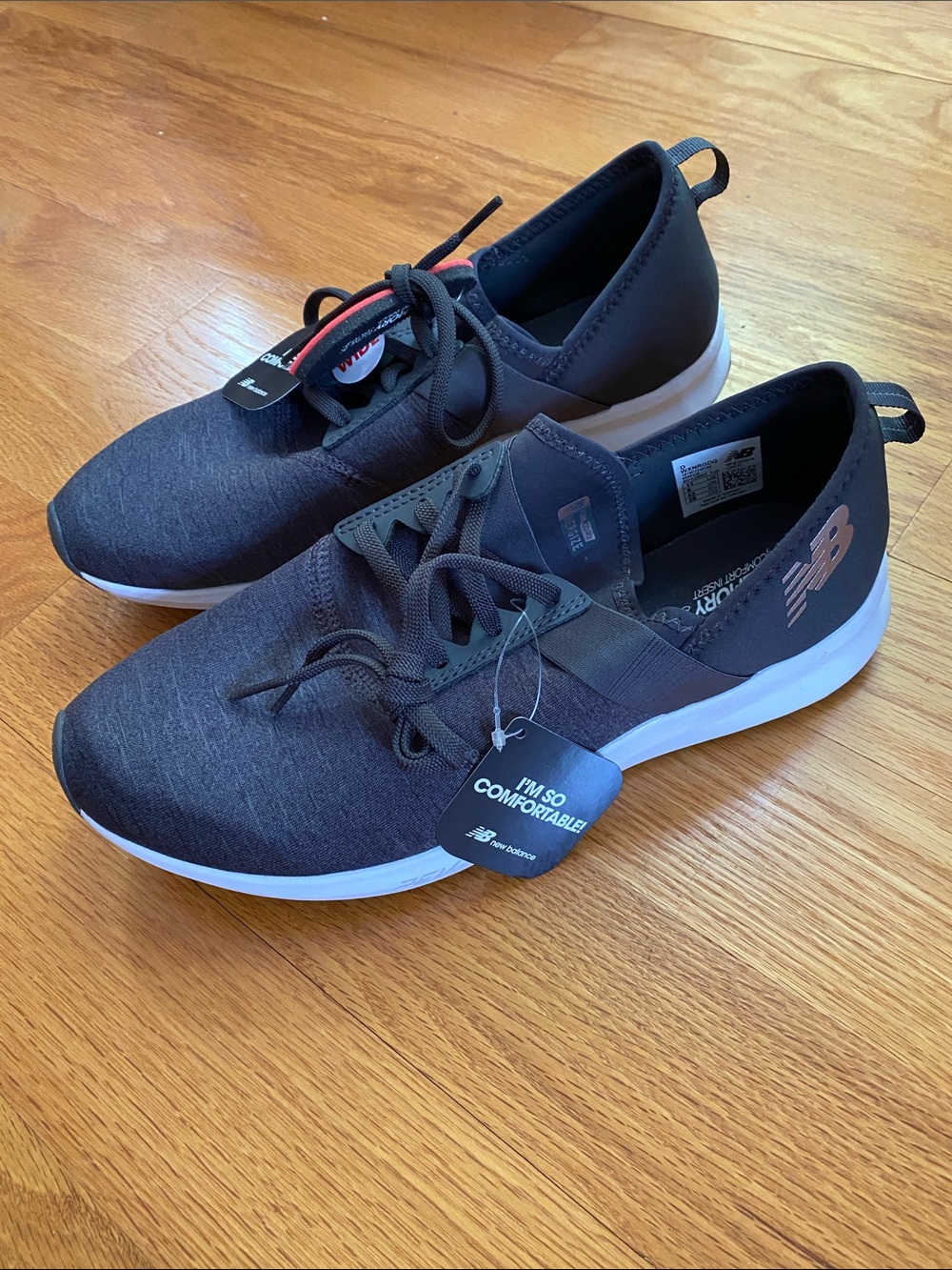 New Balance women’s Black and Gray Slip-On Lace-Up Sneakers
